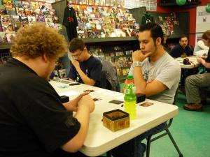 Dan Macahonic, Chad Fraser, and Dave Berkes try not to fall asleep as Kourch Chan (not in photo) plays a Tupdog deck which kills everything in a manner most scurrilous.